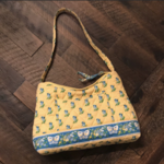 yellow Vera Bradley mini purse  is being swapped online for free