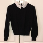 Black cropped sweater with attached collar is being swapped online for free