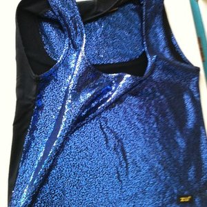 Flashy electric blue tank top size xs is being swapped online for free