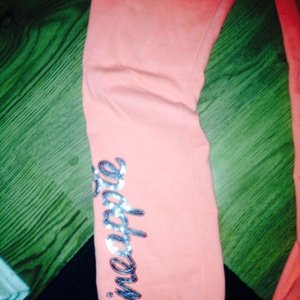 Pineapple tracksuit bottoms neon orange teenager or 10/12 uk is being swapped online for free