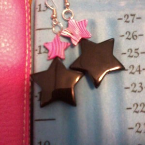 Pink zebra print/star earrings is being swapped online for free