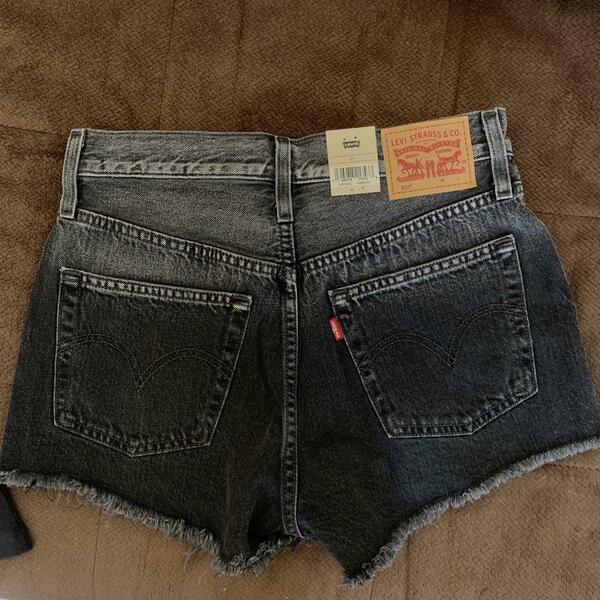 Levi's black denim shorts with button fly and raw hem is being swapped online for free