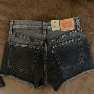 Levi's black denim shorts with button fly and raw hem is being swapped online for free