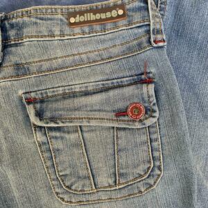 CUTEST DOLLHOUSE FLARE JEANS WITH RED STITCHING AND CUTE BUTTONS is being swapped online for free