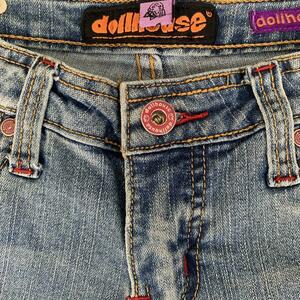 CUTEST DOLLHOUSE FLARE JEANS WITH RED STITCHING AND CUTE BUTTONS is being swapped online for free