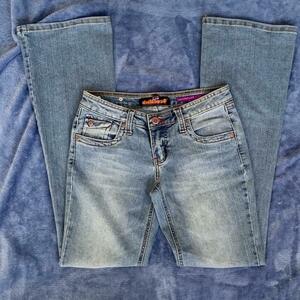 CUTEST DOLLHOUSE FLARE JEANS WITH RED STITCHING AND CUTE BUTTONS is being swapped online for free